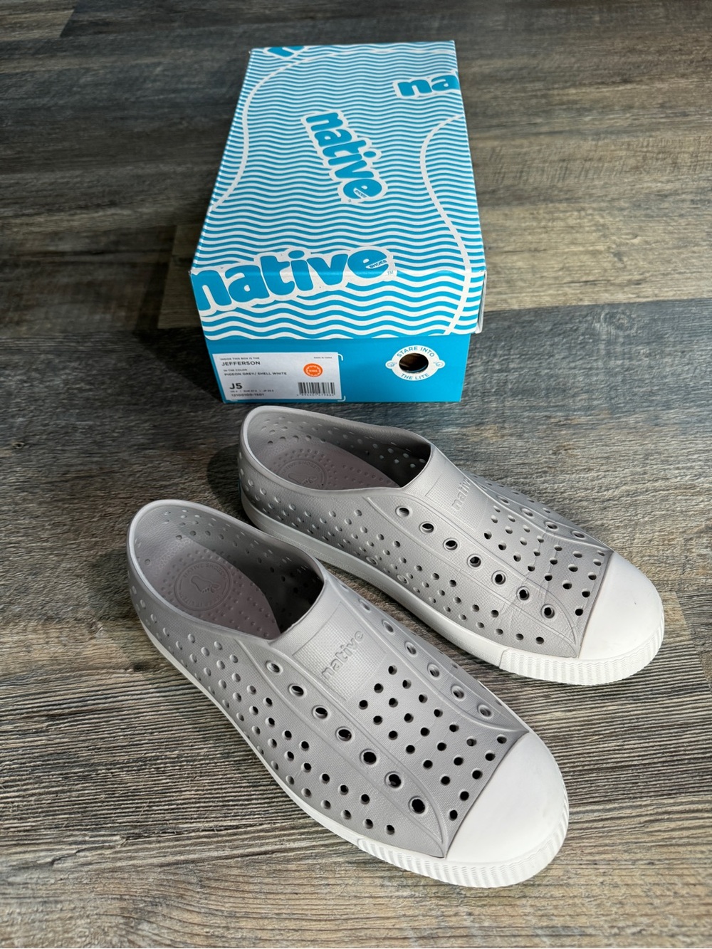 Native Jefferson Slip-On Shoes in Gray with White Toe Caps. Women 7, big kid 5.